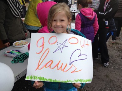 Girl with hand-drawn Terry Fox Run sign for support