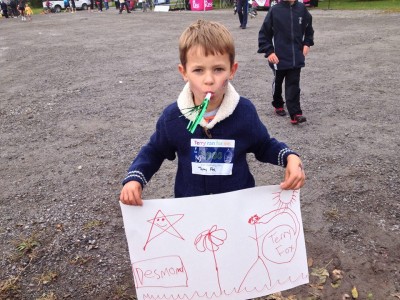 Boy with hand-drawn sign supporting the Terry Fox Run