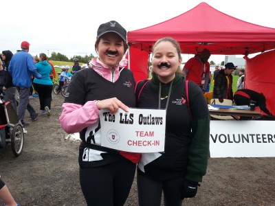 Instructor and daughter wearing fake mustaches